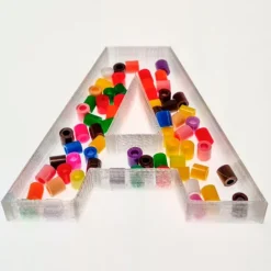 Alfabeto letras mayúsculas rellenables translúcidas 7 cm (27) - Sumando Momentos