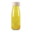 Botella sensorial flotante amarilla Float Bottle - Petit Boum